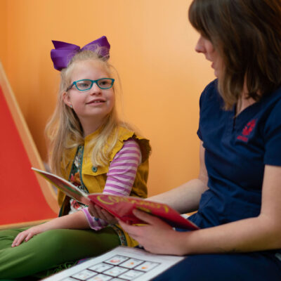 Child participating in speech therapy session